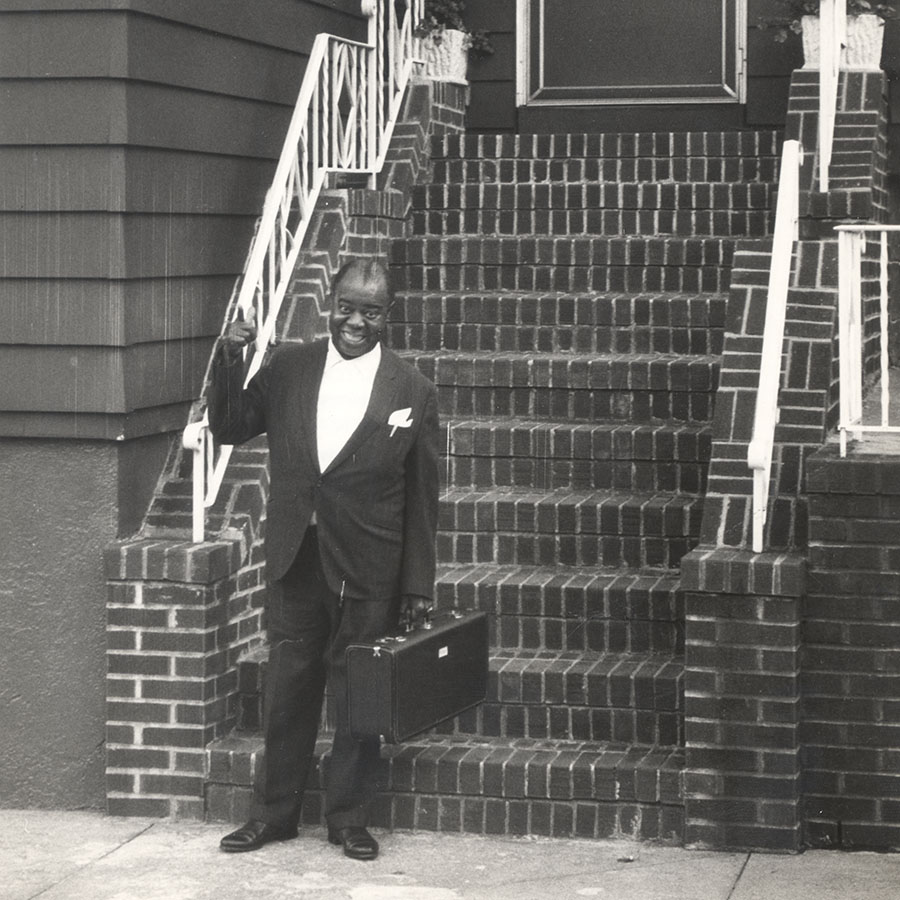 Louis Armstrong outside his house